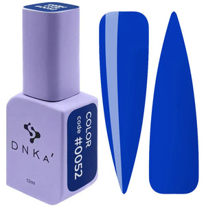 A purple DNKa' Gel Polish bottle with the cap removed, showing the blue color of the polish, alongside a blue nail polish wedge. A purple-colored DNKa' Gel Polish bottle with the code #0052 and 12 ml volume indicated