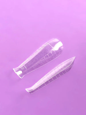 A box of DNKa' Professional Top Nail Forms, which are clear and designed for modeling nails. The box is labeled with the product name and contains 120 pieces, including various sizes for different nail shapes.