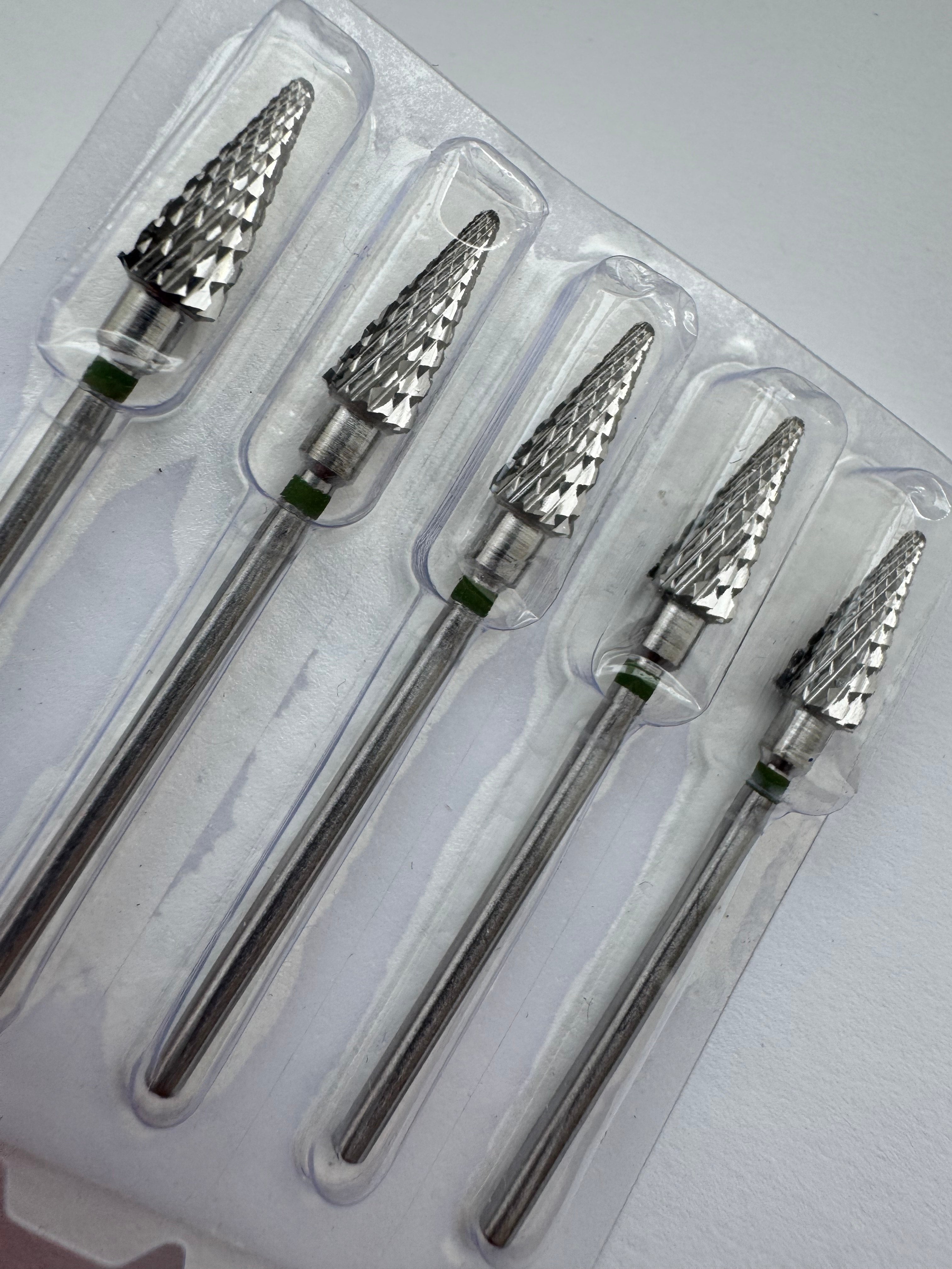 A carbide nail drill bit with a green ring at the base and a conical shape with triple cross cut design.