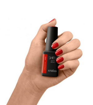 A bottle of Kinetics #522 Shield Professional Gel Polish in orange color with a black cap and label.