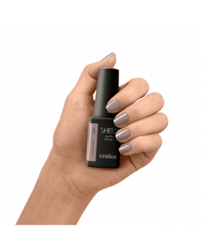 A bottle of Kinetics #203 Piano Piano SHIELD Gel Polish  brown color in a professional nail polish size and color.
