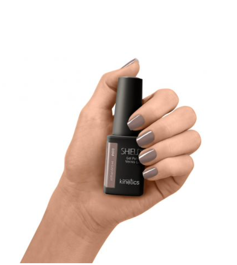 A bottle of Kinetics Shield Professional Gel Polish #610  in the color Quiet confidence, which is a timeless taupe shade.