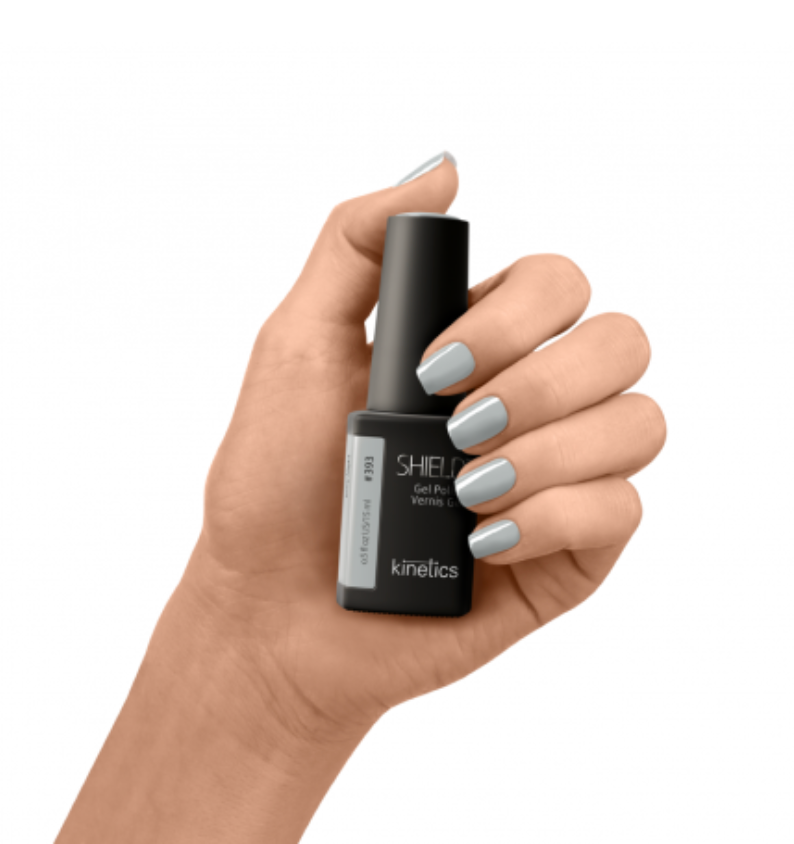 A bottle of Kinetics #393 Ivory night SHIELD professional gel polish with a matte black cap and a label that shows the product name and brand. Grey color