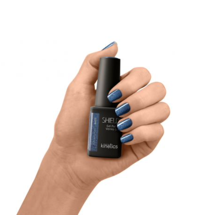A bottle of Kinetics Shield Gel Polish in the color #603 Northern breeze, which is a dark blue cat eye color