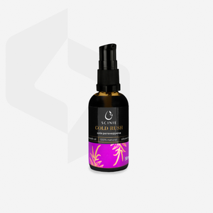 A black bottle with a pump dispenser labeled 'Scinie GOLD RUSH' containing regenerating skin oil, placed on a white surface with a shadow of a plant leaf overhead.
