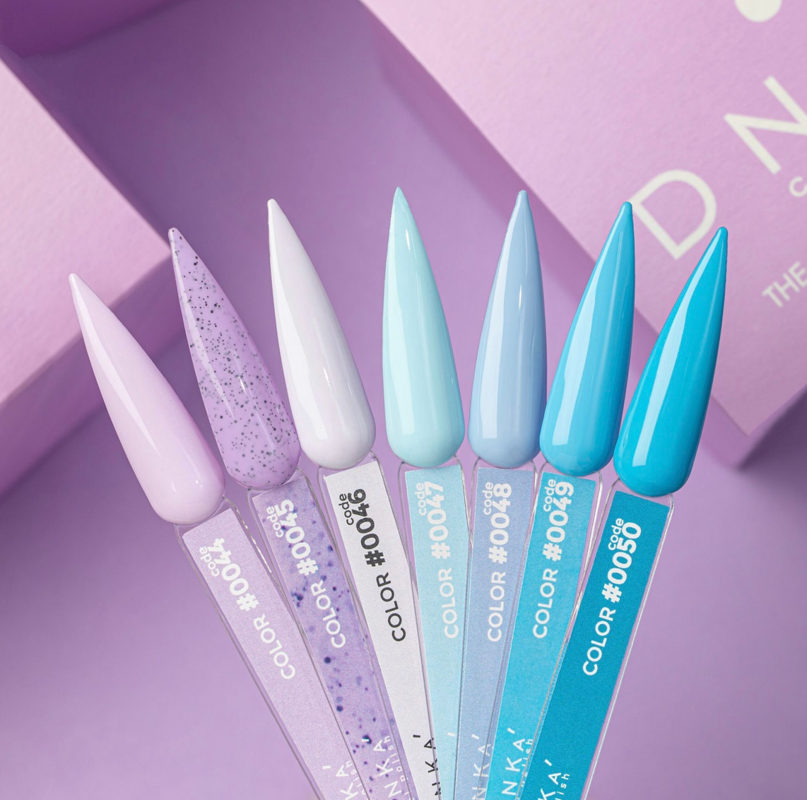 Set of blue and purple nail art tools with brand name on a purple background