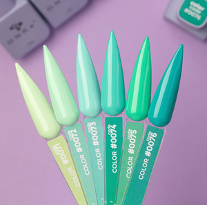 Set of green nail polish bottles with colorful tips on a purple background