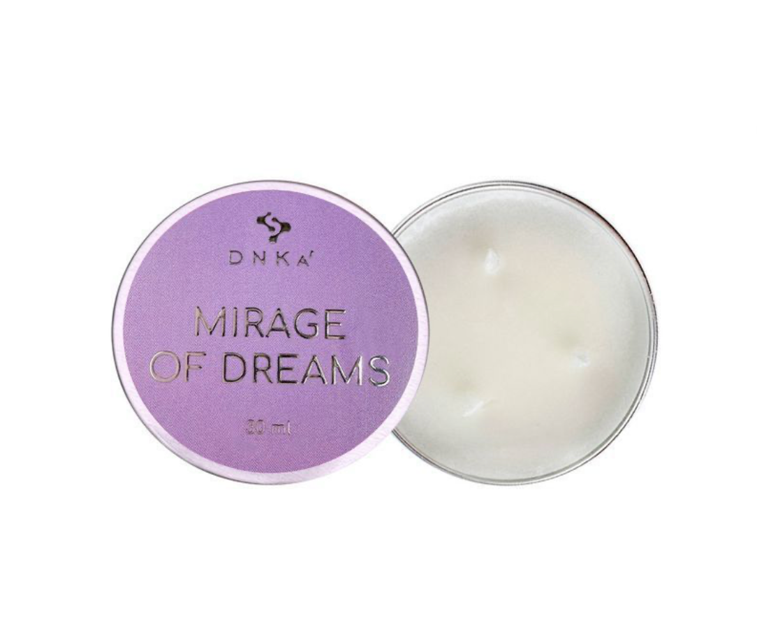 Candle with purple lid labeled 'Mirage of Dreams' by DNKA on a white background