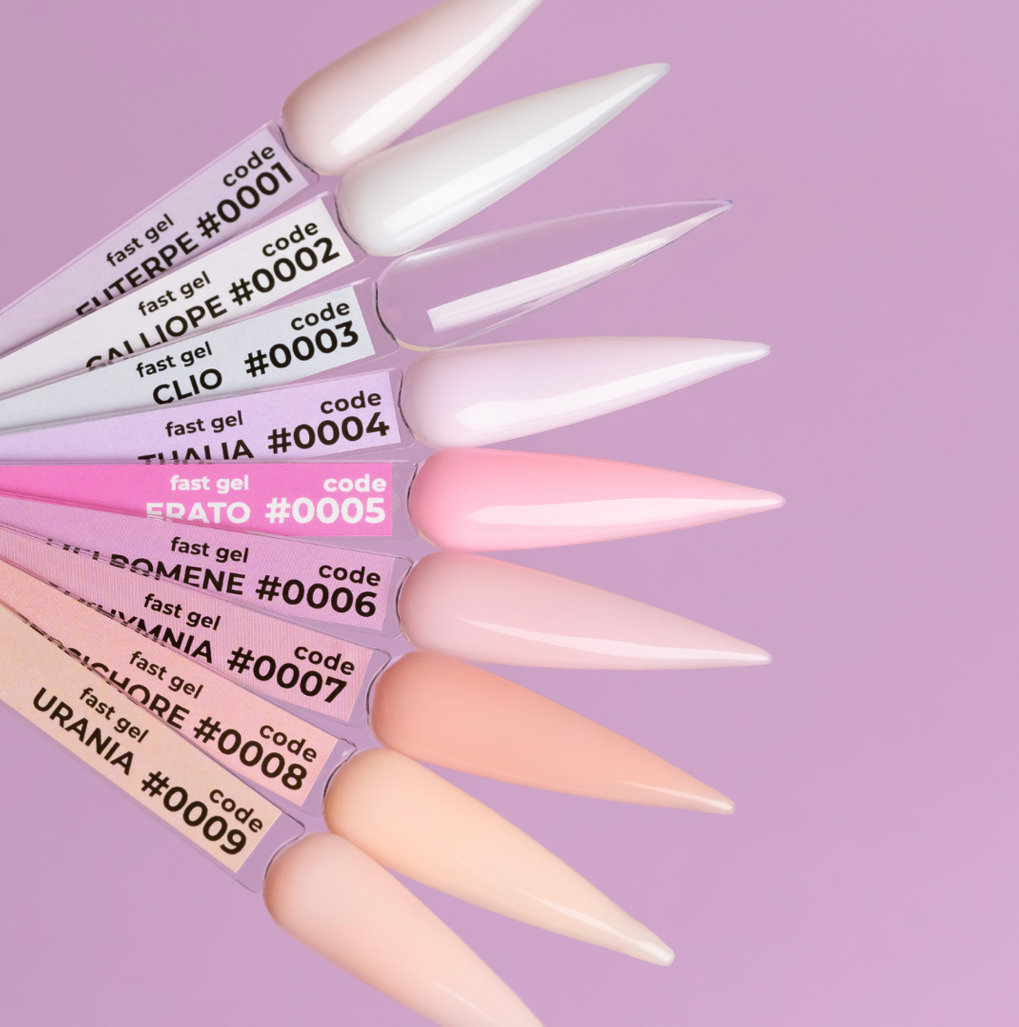 Set of long, pointed nail tips with visible brand names on a purple background