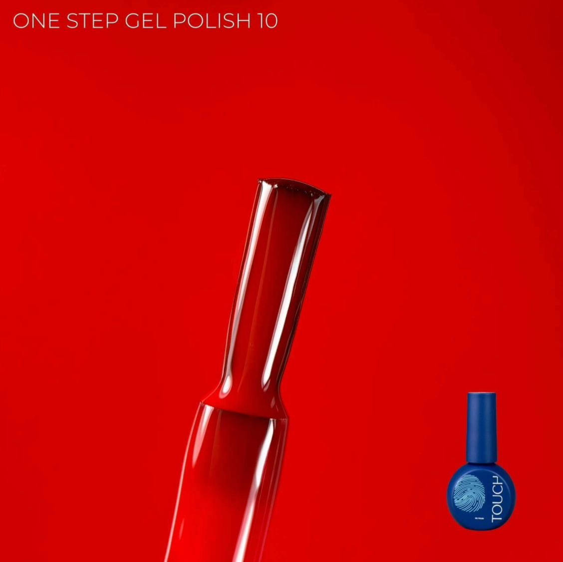 Red nail polish bottle with blue cap on a red background