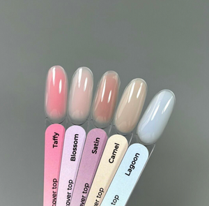 Set of nail polish samples with names on a gray background