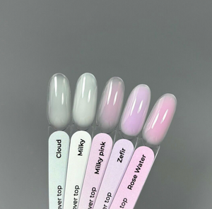 Set of nail polish samples with names on a gray background