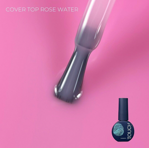 Nail polish brush and bottle with 'Touch' branding on a pink background