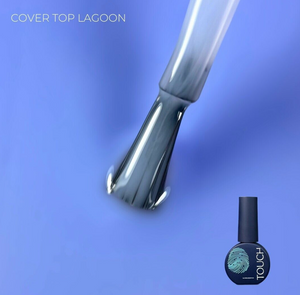 Nail polish brush and bottle with 'Cover Top Lagoon' text on a blue background