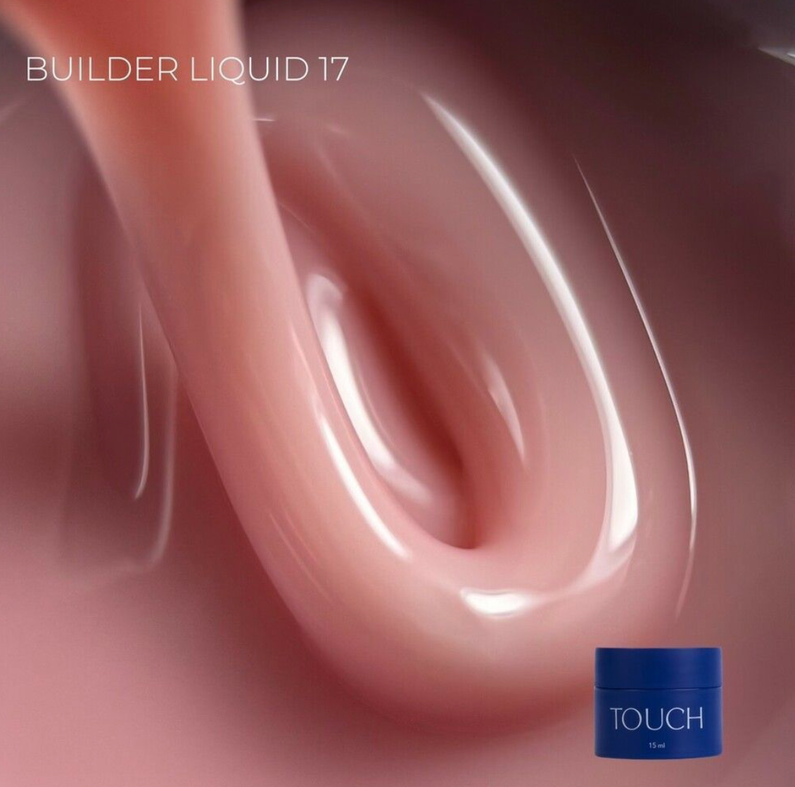 Close-up of pink liquid with a blue container labeled 'TOUCH' on a pink background.