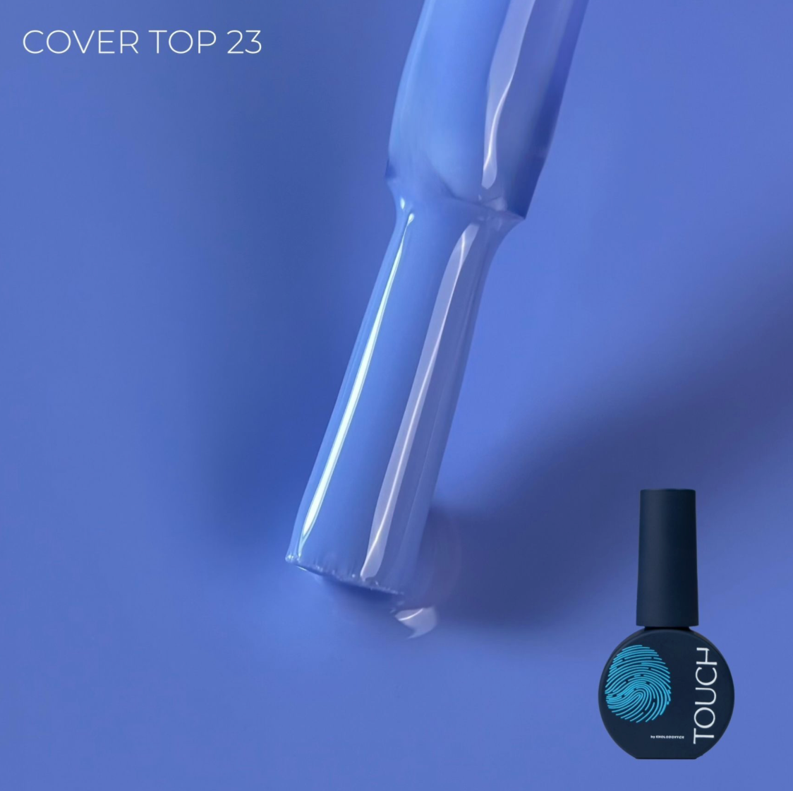 A bottle of nail polish with a brush applicator on a blue background, with the text 'COVER TOP 23' and 'TOUCH' visible on the bottle label.