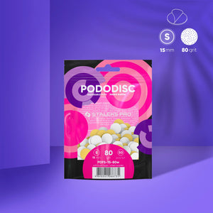 A pack of white disposable files with a soft foam layer for pedicure, labeled as 80 grit and sized S (15 mm), presented on a purple background with a 'Staleks Pro S' logo.