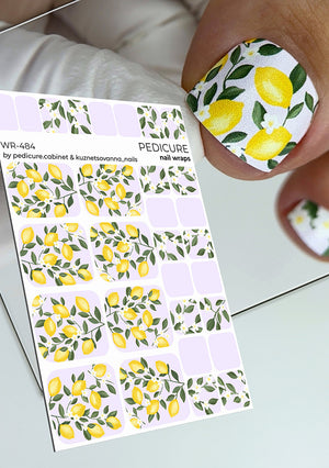 Nail wrap sheet with lemon design and a hand with decorated nails showing the pattern.