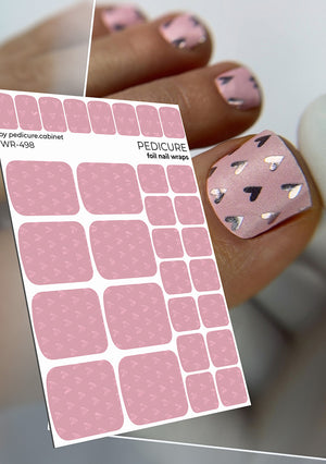 Sheet of pink pedicure foil nail wraps with a close-up of applied nail wraps on a finger.