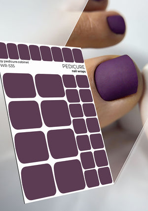 Purple nail wrap sheet with a hand wearing a purple manicure on a white background