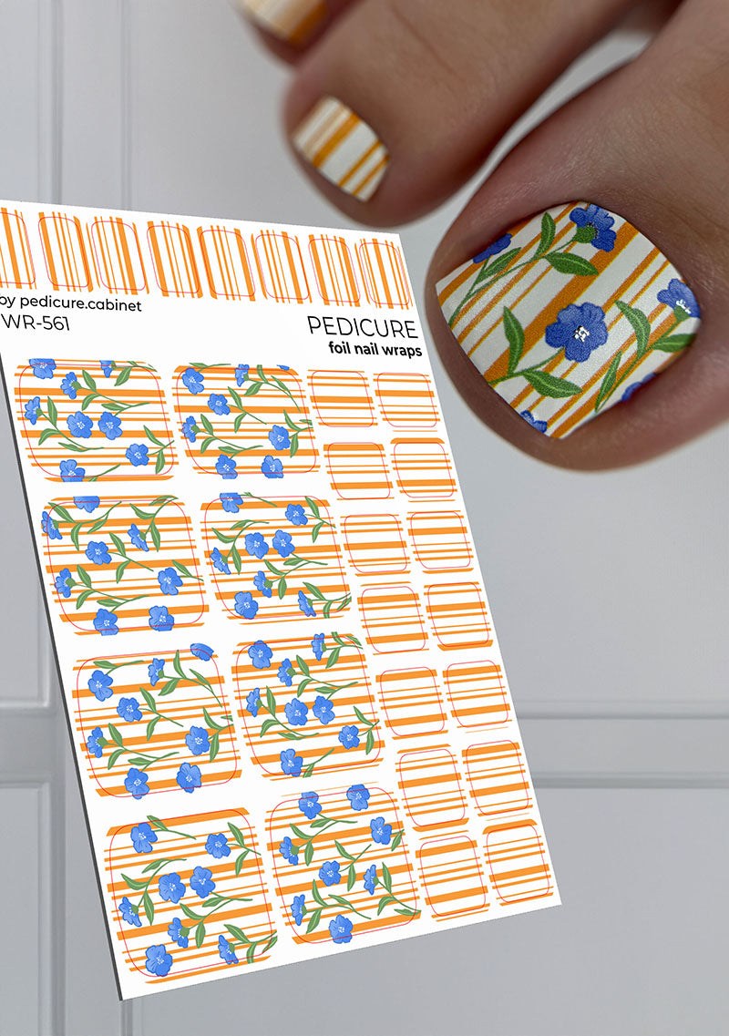 Nail wrap sheet with floral design and a hand with decorated nails against a neutral background
