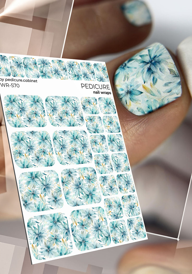 Sheet of floral nail wraps with a close-up of applied nail wrap on a thumb.