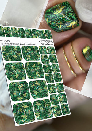 Sheet of green leaf-patterned foil nail wraps with a close-up of a manicured nail wearing one.