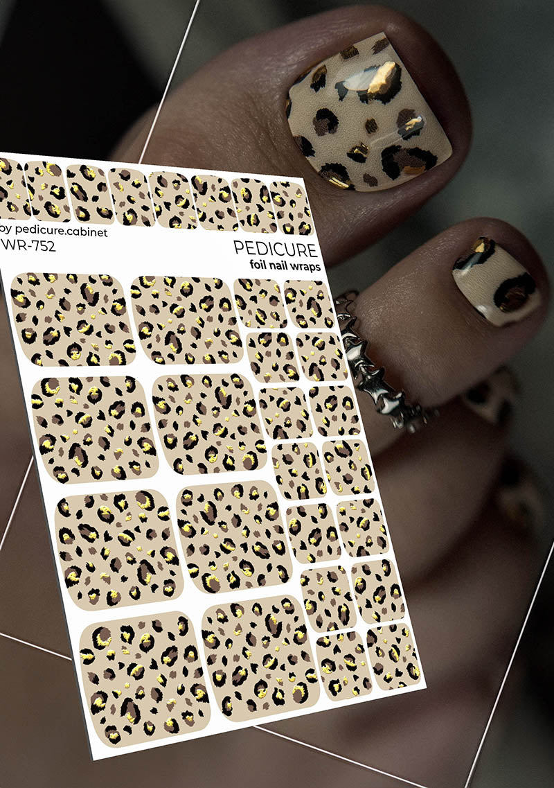 Leopard print nail wraps with a hand displaying similar design.