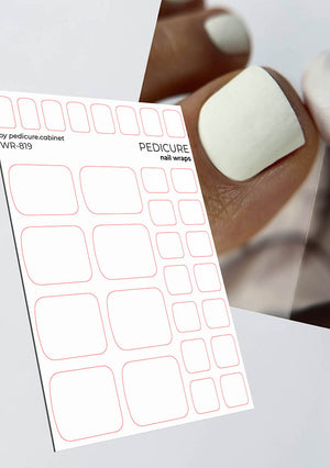 Sheet of nail wraps with a blurred background of a hand with white nail polish.