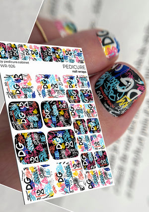 Sheet of nail art stickers with colorful designs and a hand wearing a nail with a sticker.