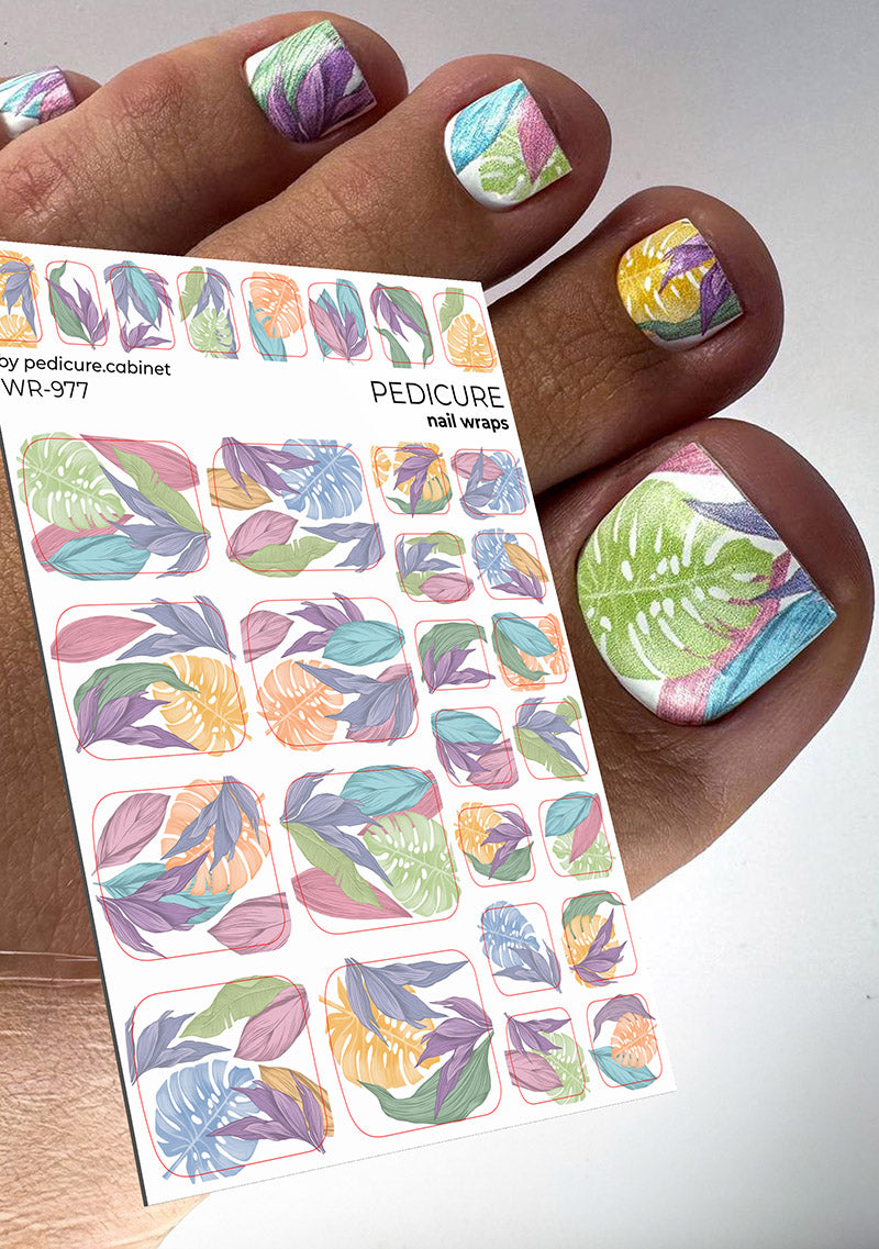 Large leaves pastel nail wrap WR‑97 applied on toenails with multicolor leaf design and matching sheet of wraps