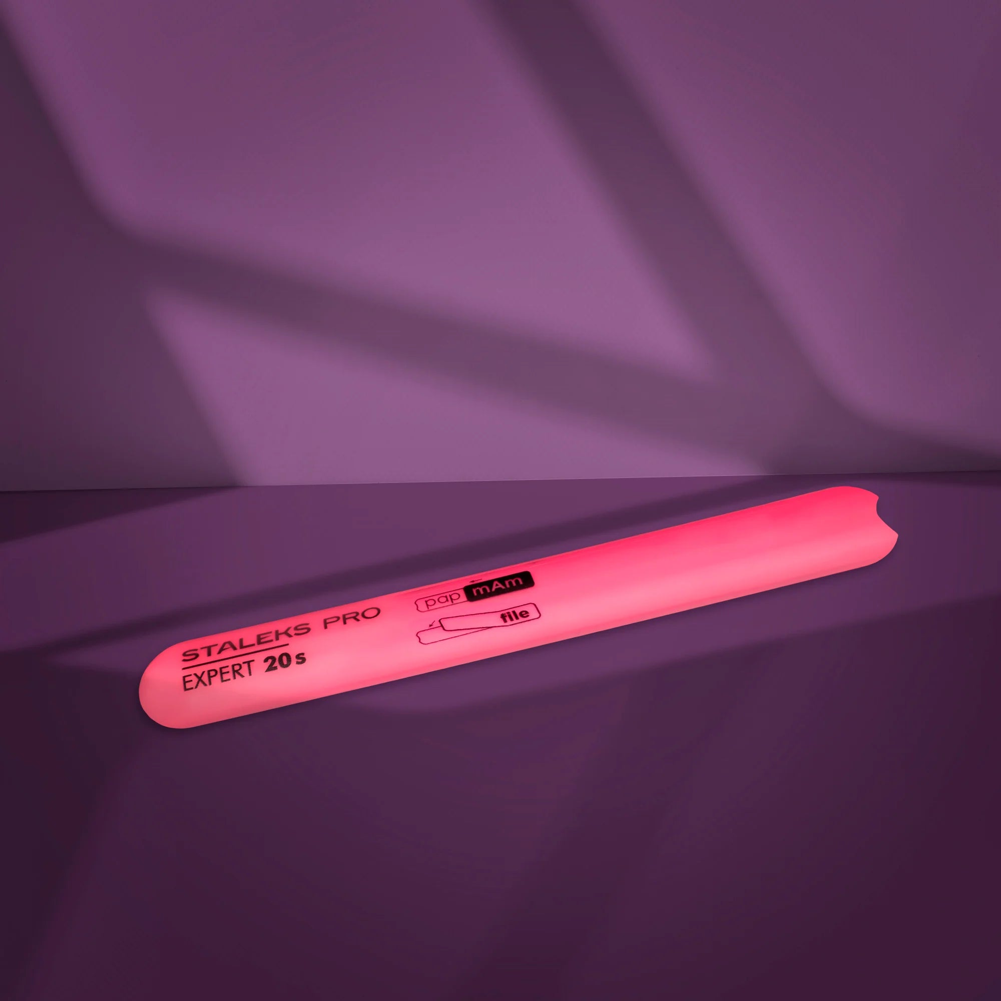 A pink plastic nail file base with beveled edges, marked with the brand STALEKS PRO and the model EXPERT 20s.