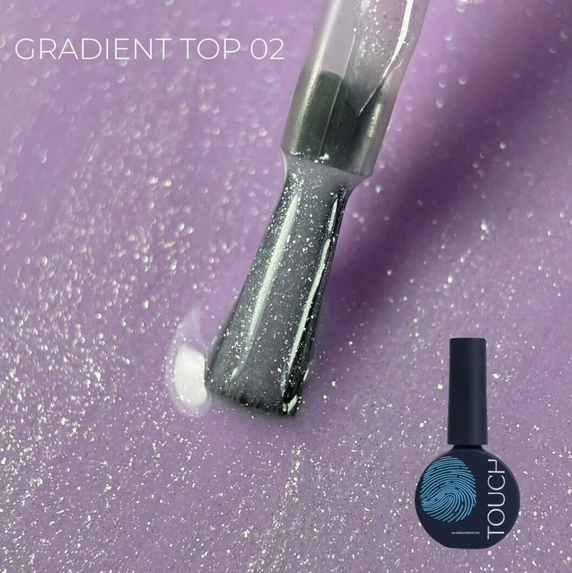 A bottle of gradient top coat nail polish with a brush showing the shimmering finish, set against a sparkling lavender-purple background with the text 'GRADIENT TOP-02'.