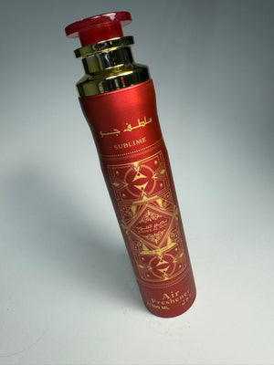 A red bottle of Lattafa Sublime Air Freshener with a gold-colored cap and decorative patterns.