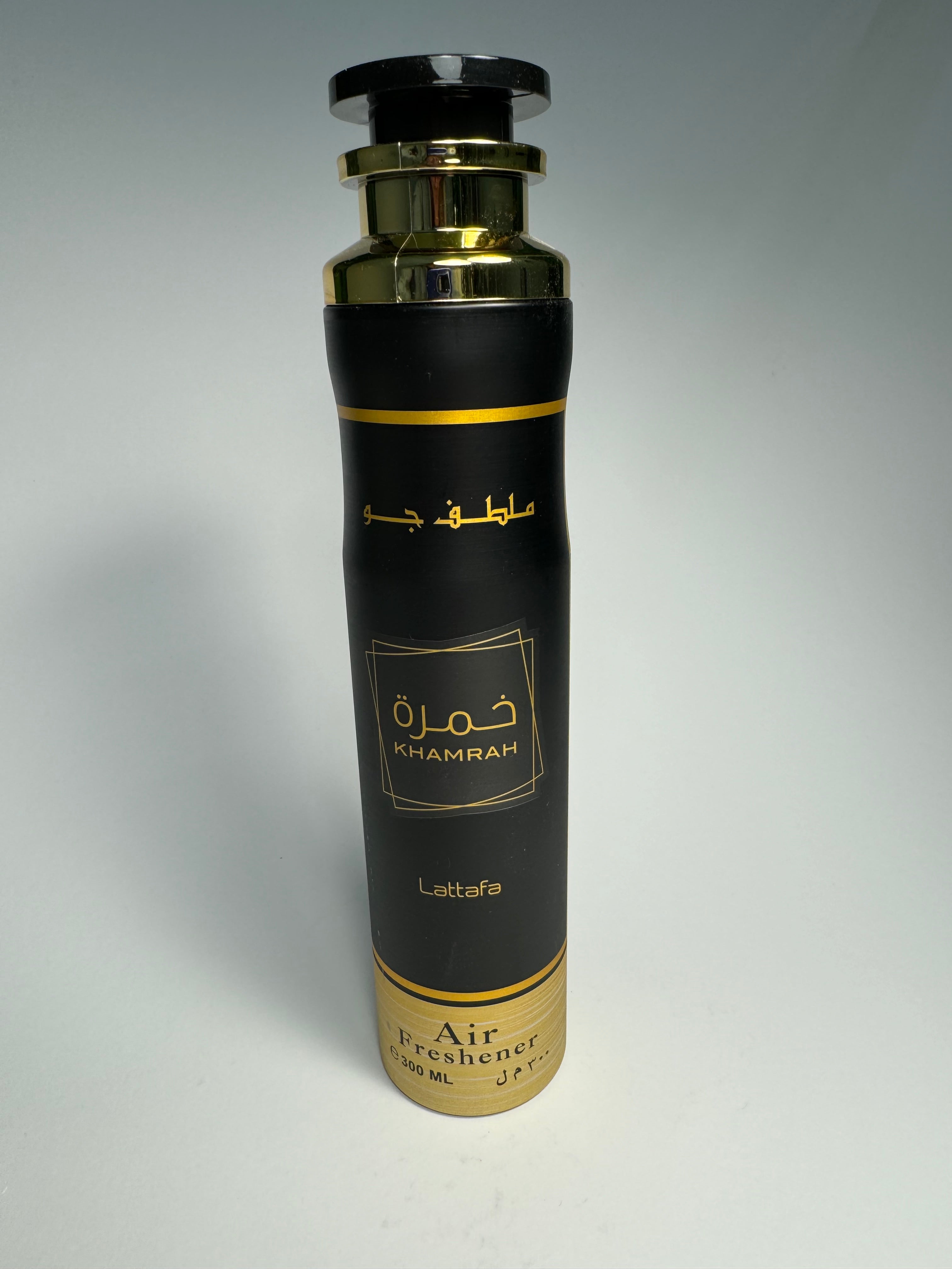 A black and gold spray bottle of Lattafa Khamrah Air Freshener, 300 ml.