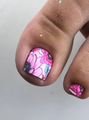 Nail with pink floral design on a neutral background