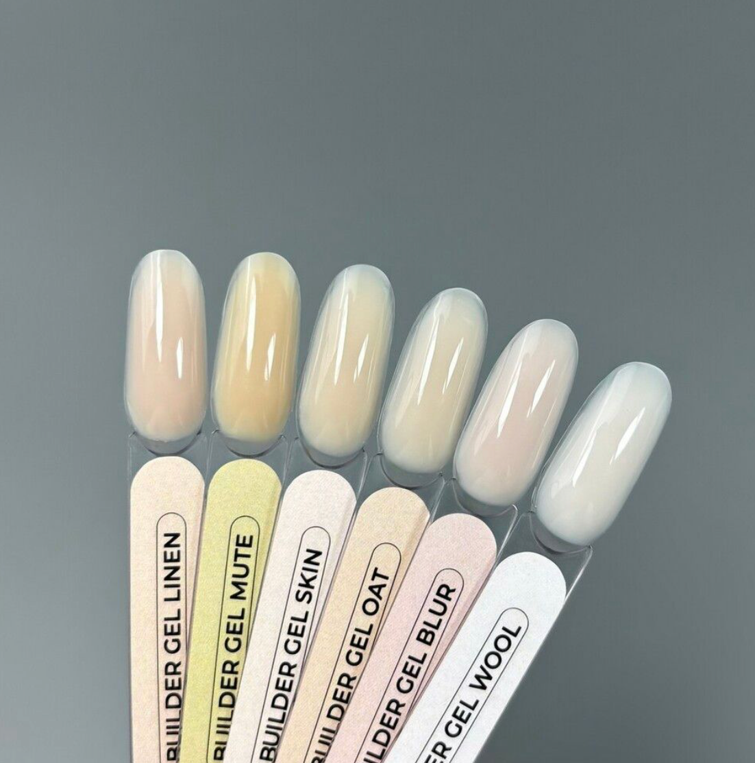 TOUCH Builder Gel color samples showing beige, cream, and milk shades on gray surface
