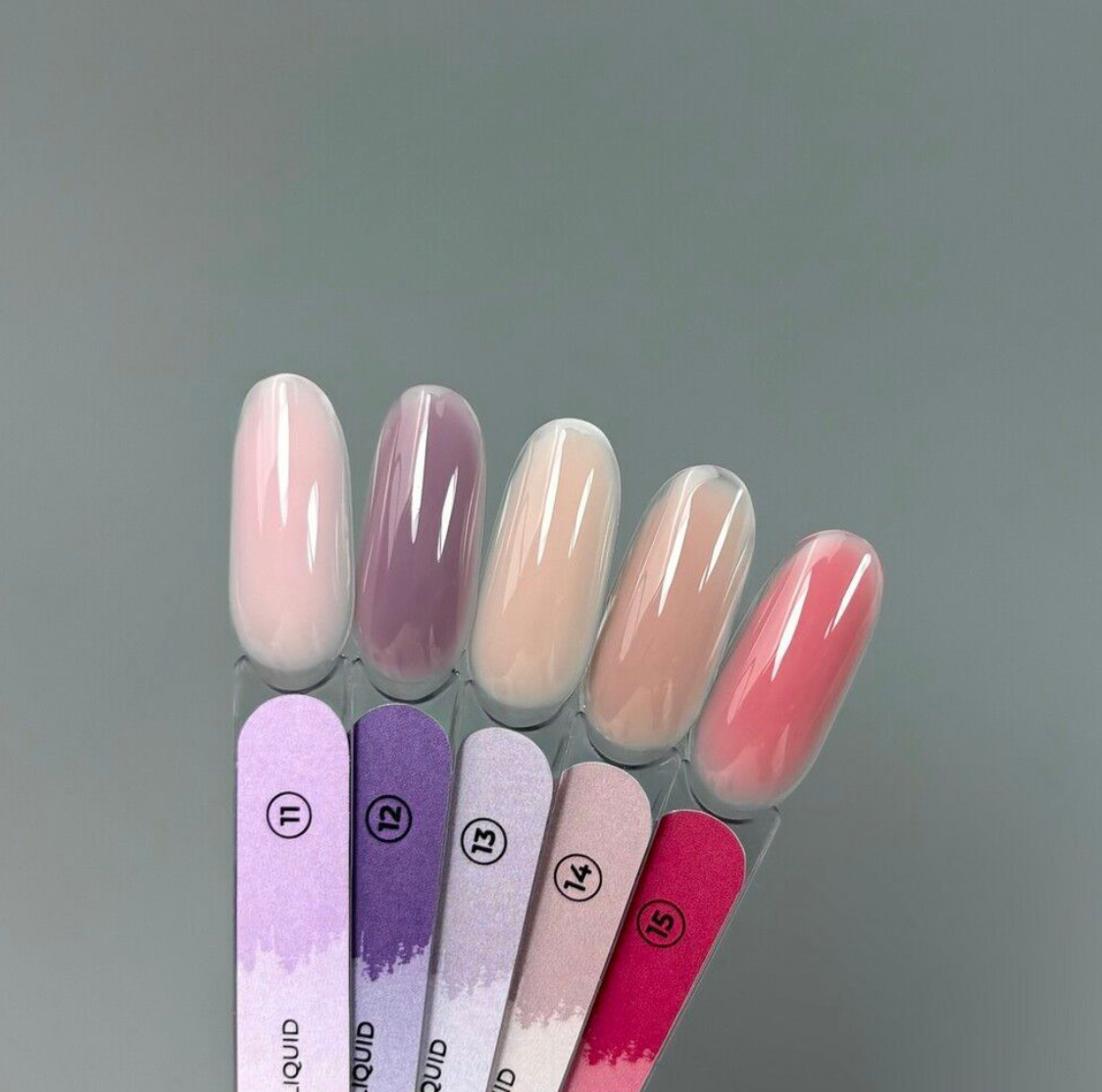 Set of nail color swatches with a gradient effect on a gray background