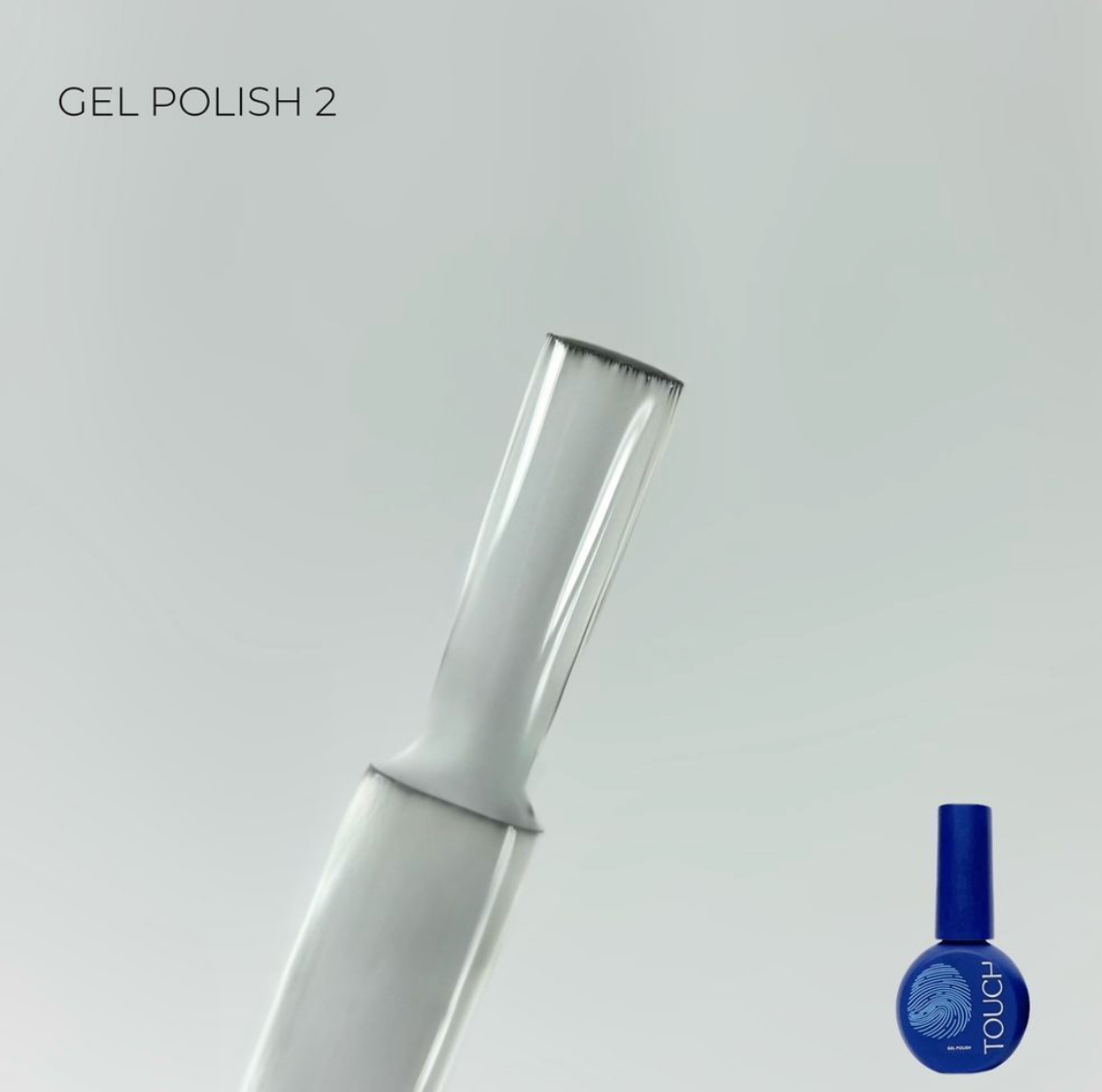 Nail polish bottle with blue polish and white applicator on a light gray background