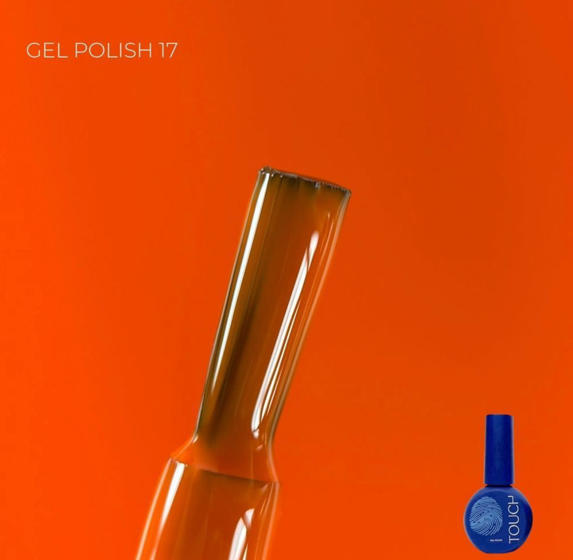 Gel polish bottle with a blue cap on an orange background
