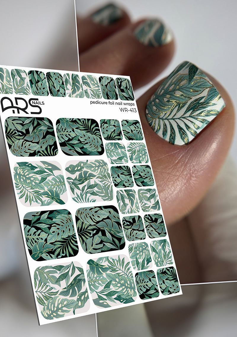 Nail art foil sheet with green leaf pattern held by a hand with matching nails.
