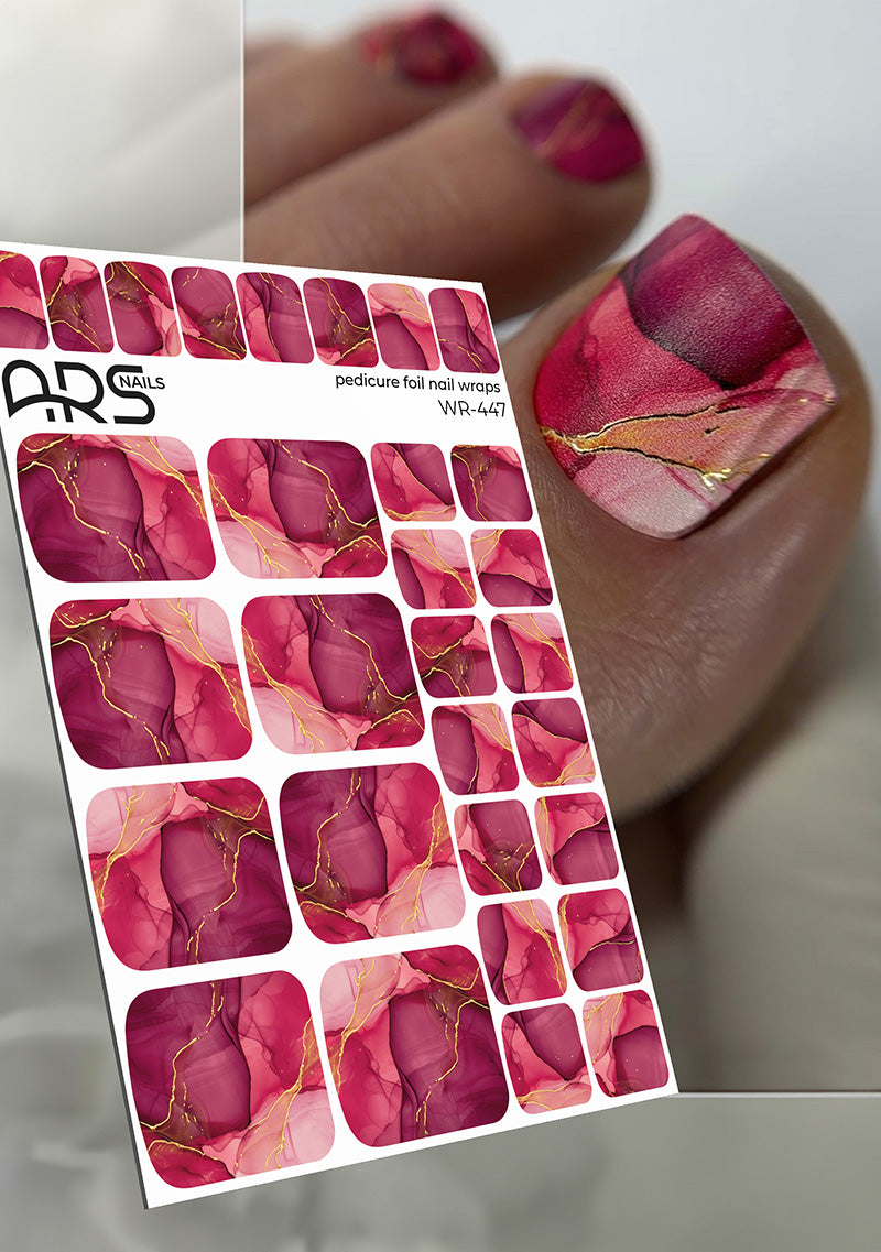 Sheet of pink and gold nail art stickers with a close-up of applied nails.