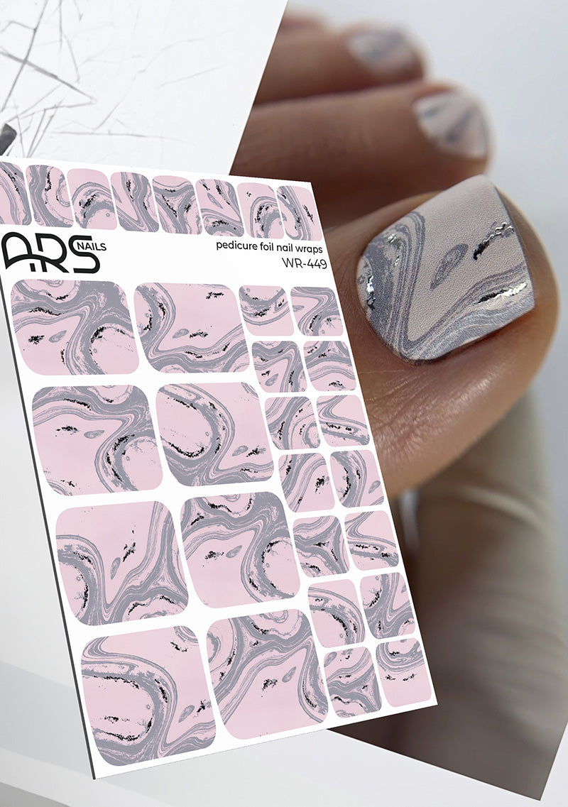 Marble patterned nail art foil sheet with a close-up of nails wearing the design.