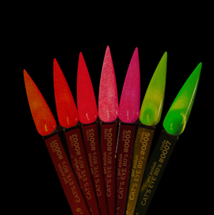 Set of colorful nail art brushes with 'Cat's Eye' branding on a black background