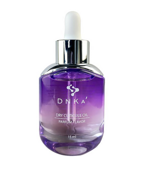 Purple bottle of DNKA dry cuticle oil with a dropper on a white background
