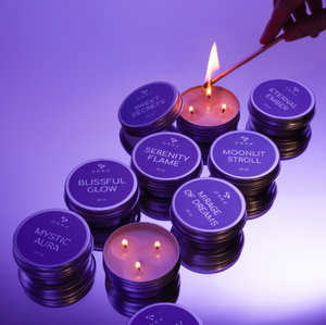 Candle with purple lids labeled with names, being lit against a purple background