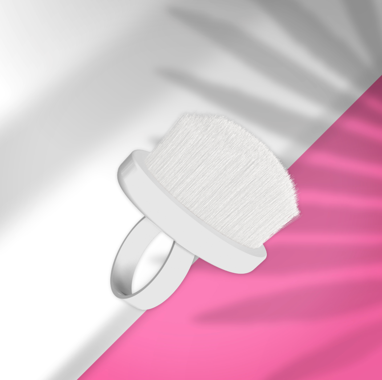 White facial cleansing brush on a pink and gray gradient background