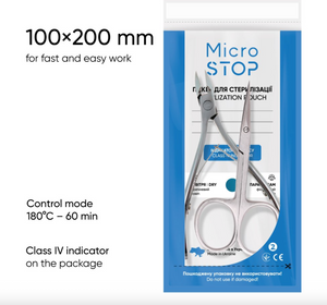 Scissors in packaging with sterilization information on a white background