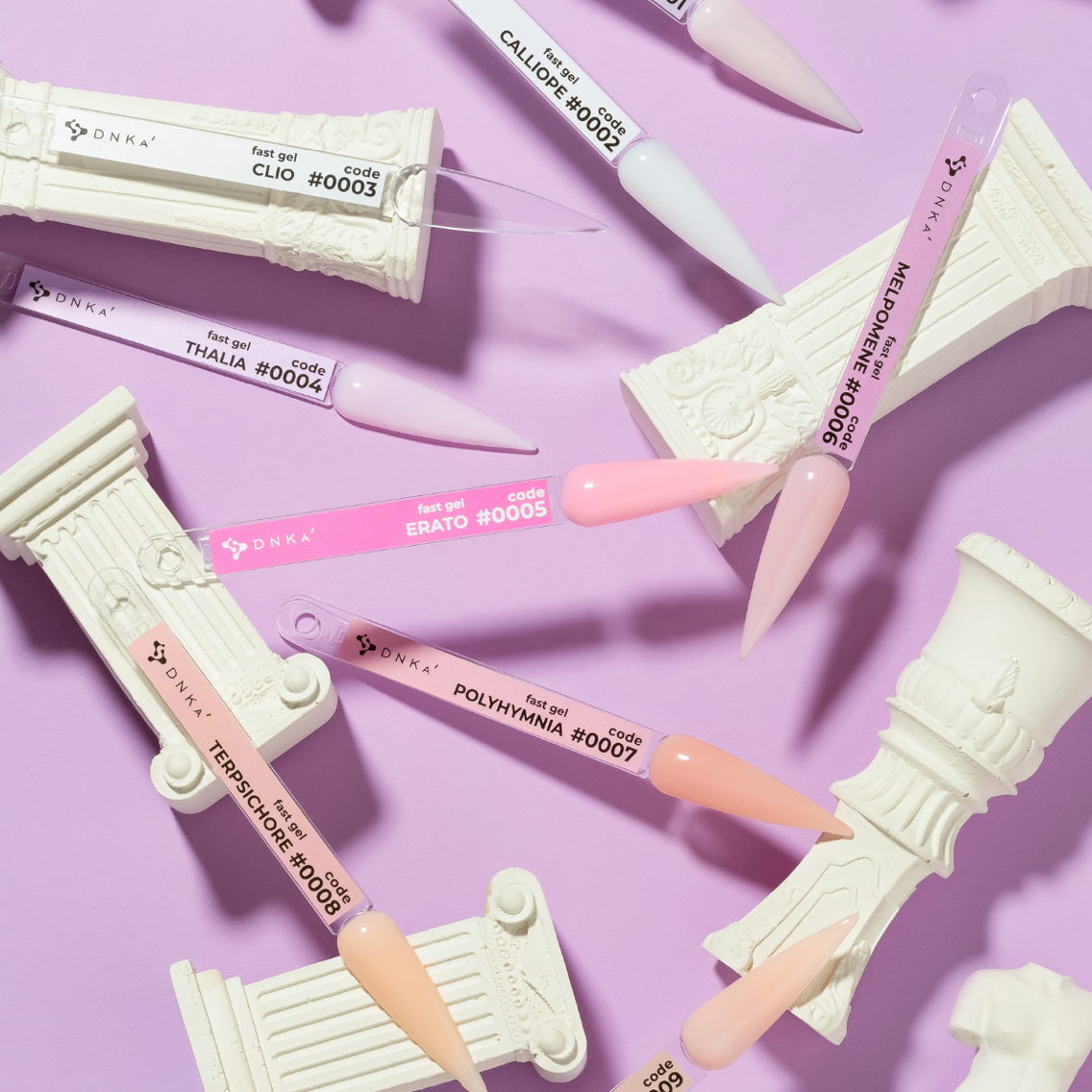 Set of cosmetic applicators with visible branding on a purple background