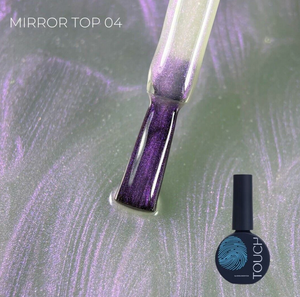 Nail polish bottle with a purple glittery tip on a textured surface, featuring the brand 'TOUCH'.